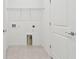 Bright laundry room with shelving and tile floor at 3008 Forest Meadow Ave, Valrico, FL 33594