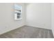Simple bedroom with grey carpet and window at 3008 Forest Meadow Ave, Valrico, FL 33594
