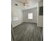 Bright bedroom with gray vinyl flooring and ceiling fan at 514 Fitzhugh Ave, Punta Gorda, FL 33950