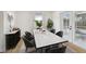 Bright dining room featuring a marble-top table, modern furnishings and ample natural light at 8320 Boxwood Dr, Tampa, FL 33615
