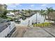 Picturesque waterfront view featuring boat docks and a tranquil canal under a sunny sky at 8320 Boxwood Dr, Tampa, FL 33615