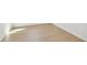 Light brown luxury vinyl plank flooring at 3008 Forest Meadow Ave, Valrico, FL 33594