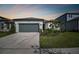 Two-car garage and well-manicured lawn at 3008 Forest Meadow Ave, Valrico, FL 33594