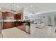 Open-concept kitchen with stainless appliances, breakfast bar, and seamless flow into living area at 11329 Emerson Lake Dr, Riverview, FL 33578
