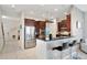 Modern kitchen with stainless steel appliances, a breakfast bar, and ample cabinet space at 11329 Emerson Lake Dr, Riverview, FL 33578