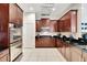 Well-equipped kitchen with stainless steel appliances, a gas range, and generous counter space at 11329 Emerson Lake Dr, Riverview, FL 33578
