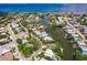 Expansive aerial view of waterfront property on canal with ocean view in the distance at 210 Lakeview Dr, Anna Maria, FL 34216