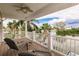 Scenic waterfront views from private covered balcony with seating at 210 Lakeview Dr, Anna Maria, FL 34216