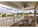 Relaxing balcony with ceiling fan overlooking the waterfront at 210 Lakeview Dr, Anna Maria, FL 34216