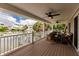 Inviting waterfront balcony with comfortable seating, ceiling fans, and picturesque views, ideal for relaxing and entertaining at 210 Lakeview Dr, Anna Maria, FL 34216
