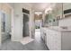 Bright bathroom with double vanity, walk-in shower, and tile floors at 210 Lakeview Dr, Anna Maria, FL 34216