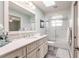 Well-lit bathroom vanity with tub-shower combo and modern finishes at 210 Lakeview Dr, Anna Maria, FL 34216