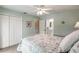 Inviting bedroom with ceiling fan and closet with ensuite bathroom access at 210 Lakeview Dr, Anna Maria, FL 34216