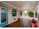 Charming outdoor deck featuring a private entrance, storage and a kayak for enjoying waterfront living at 210 Lakeview Dr, Anna Maria, FL 34216
