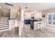Updated kitchen and stairs lead to upper level, open to bright dining room at 210 Lakeview Dr, Anna Maria, FL 34216