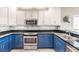 Bright kitchen featuring stainless steel appliances, custom backsplash and modern cabinetry at 210 Lakeview Dr, Anna Maria, FL 34216