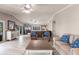 Spacious living room with stylish furniture, a modern TV, and access to the outside patio at 210 Lakeview Dr, Anna Maria, FL 34216