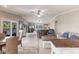 Spacious living room with stylish furniture, a modern TV, and access to the outside patio at 210 Lakeview Dr, Anna Maria, FL 34216
