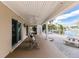 Covered back patio with seating and waterfront access at 210 Lakeview Dr, Anna Maria, FL 34216
