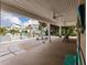 Inviting covered patio with outdoor seating and scenic waterfront views, perfect for relaxation and entertaining at 210 Lakeview Dr, Anna Maria, FL 34216