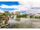 Expansive waterfront view featuring lush greenery and dockage at 210 Lakeview Dr, Anna Maria, FL 34216