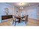 Formal dining room with hardwood floors and a six-chair table at 6801 Lockington Ct, Tampa, FL 33625