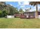 Backyard with a deck and above ground pool at 807 Louise St, Brandon, FL 33511