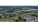 Aerial view of a residential neighborhood near a waterway and office park at 8816 Ascot Ct, Tampa, FL 33634
