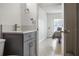Modern bathroom with gray vanity and granite shower at 8816 Ascot Ct, Tampa, FL 33634