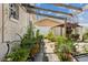 Landscaped backyard with lush greenery and wooden arbor at 8816 Ascot Ct, Tampa, FL 33634
