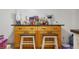 Basement features a kitchen island with seating and storage cabinets at 8816 Ascot Ct, Tampa, FL 33634