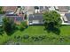 Aerial view showing house with solar panels and lush greenery at 8816 Ascot Ct, Tampa, FL 33634