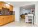 Kitchen with light wood cabinets, granite counters and breakfast bar at 8816 Ascot Ct, Tampa, FL 33634