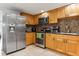 Kitchen with stainless steel appliances and light wood cabinets at 8816 Ascot Ct, Tampa, FL 33634