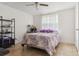 Bright bedroom featuring a comfy bed and tile floor at 8816 Ascot Ct, Tampa, FL 33634