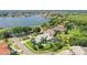 Two-story house with a green roof and a pool, located in a waterfront community at 5709 E Longboat Blvd, Tampa, FL 33615