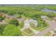 Two-story house with a green roof and a pool, situated in a waterfront community at 5709 E Longboat Blvd, Tampa, FL 33615