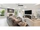 Bright living room featuring a fireplace and comfortable seating area at 5709 E Longboat Blvd, Tampa, FL 33615
