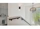 Modern staircase with glass block window and light fixtures at 5709 E Longboat Blvd, Tampa, FL 33615