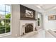 Modern fireplace with dark gray mantel and bronze accents at 5709 E Longboat Blvd, Tampa, FL 33615