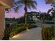 Landscaped front yard with walkway, offering curb appeal and views at 5709 E Longboat Blvd, Tampa, FL 33615
