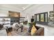 Open living room with a modern fireplace and comfortable seating at 5709 E Longboat Blvd, Tampa, FL 33615