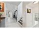 Clean and bright hallway with modern staircase at 5709 E Longboat Blvd, Tampa, FL 33615