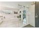 Spa-like bathroom with soaking tub, glass shower, and modern fixtures at 5709 E Longboat Blvd, Tampa, FL 33615