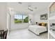 Spacious bedroom with large window and backyard view at 5709 E Longboat Blvd, Tampa, FL 33615