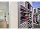Large walk-in closet with shelving and drawers at 5709 E Longboat Blvd, Tampa, FL 33615