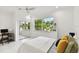 Light and airy bedroom with mirrored closet doors at 5709 E Longboat Blvd, Tampa, FL 33615