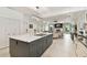 Open concept kitchen with large island and marble countertops at 5709 E Longboat Blvd, Tampa, FL 33615