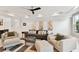 Living room with cozy seating and large windows at 5709 E Longboat Blvd, Tampa, FL 33615