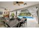 Patio with dining and seating areas near the pool at 5709 E Longboat Blvd, Tampa, FL 33615